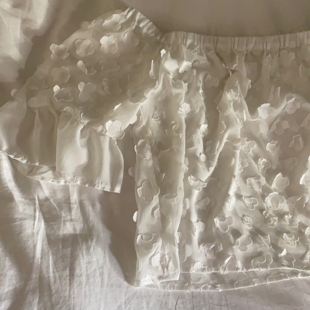White flowery blouse